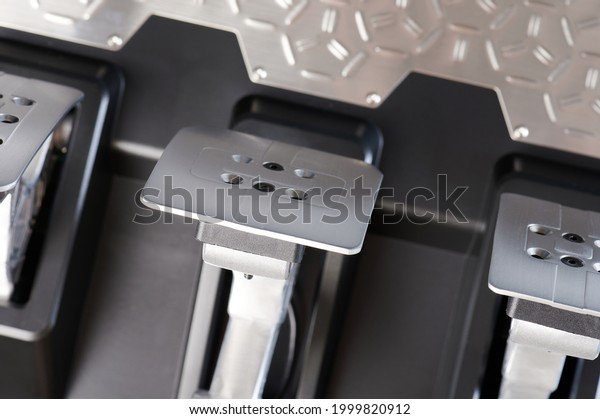 Shiny\
sport car pedals with chrome pads close up\
view
