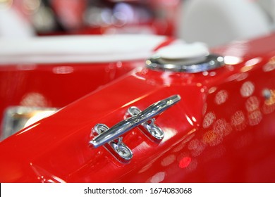 Shiny Stainless Mooring Cleat On Red Plastic Motor Boat Deck Close Up, Marine Equipment