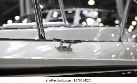 Shiny Stainless Mooring Cleat On White Motor Boat Deck Close Up, Marine Equipment