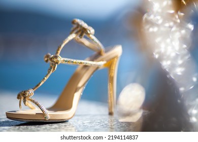 Shiny Wedding Shoes On A Stone Windowsill.