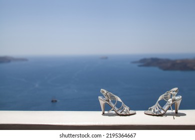 Shiny Wedding Shoes On A Stone Windowsill.