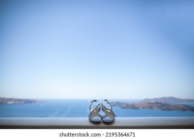 Shiny Wedding Shoes On A Stone Windowsill.