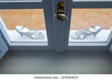 Shiny Wedding Shoes On A Stone Windowsill.