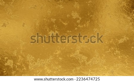 Shiny wrinkled gold foil texture. Scratched metal background.