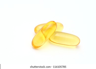 Shiny Yellow Vitamin E Fish Oil Capsule Isolated On White Background