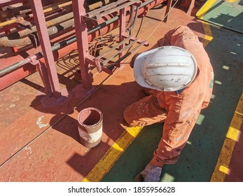 A Ship Crew Is Painting A Cat Walk During Maintenance Period On A Cargo Ship Or Bulk Carrier. 