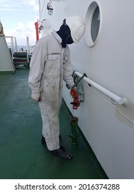 A Ship Crew Is Taking Sounding Of A Ballast Tank For Draft Survey Calculation On Aboard A Cargo Ship Or Bulk Carrier.