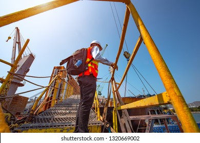 Ship Crew, Worker, Foreman Offshore In Replacement Or Change Duty On Board The Ship Or Rig Station, Climbing Ladder Gangway Bridge In High Position At Risk Or Danger In Working