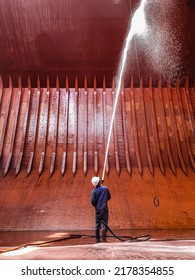 ship crews are performing cargo hold cleaning on a bulk carrier. preparing for loading cargo. - Shutterstock ID 2178354855