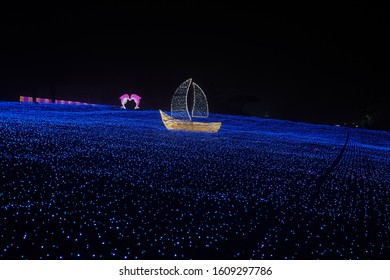 Ship And Dolphins On The Blue Sea Decorated With The Colorful Lights At The Garden Of Morning Calm, Gapyeong County, South Korea