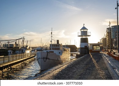 Ship in front of lighthouse in Oslo port, Norway