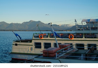 a ship on lake Chiemsee in Prien, Bavaria (Germany) with the Alps in the background	                               