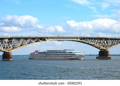 A ship passes under the bridge through the Volga River in Saratov.