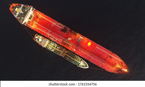ship to ship  petrolum transfer operation at west africa offshore area.night time ,top view