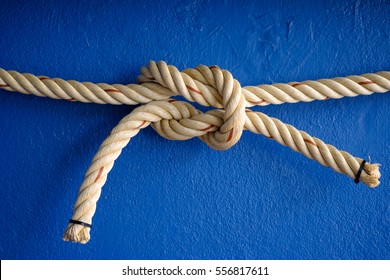 Ship Rope Knot On Blue Concrete Background