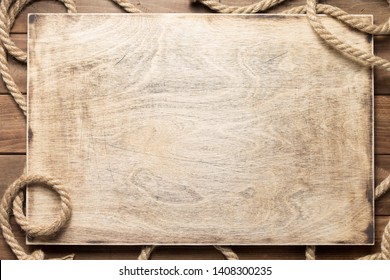 ship rope at wooden board background texture, top veiw