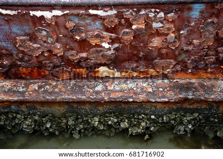 Ship rust with mussels and barnacles.