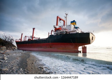 Ship is at the sea shore. Dramatic sky with clouds - Shutterstock ID 1264447189