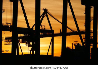 Ship to shore container cranes at sunrise 
