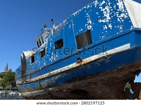 A ship that had previously sunk is lying in the harbor of Eckernförde