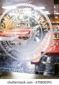 Ship Tour USS Kearsarge (LHD 3) Wasp-class Amphibious Assault Ship: Department Of The Navy Emblem Etched On Plexiglass Divider In Mess Hall. Fleet Week NEW YORK MAY 25 2017.