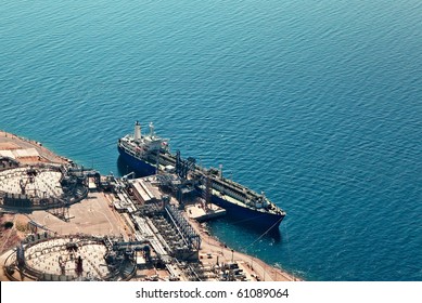 Ship Unloading At Liquified Natural Gas Terminal