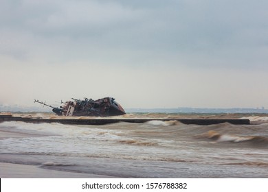 Ship Wreck Of Oil Refueling Ship On A Public Beach.