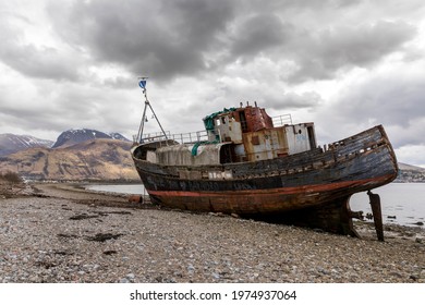 ship wreck on Loch Linnhe shore at Corpach Scotland with Ben Nevis in background - Powered by Shutterstock