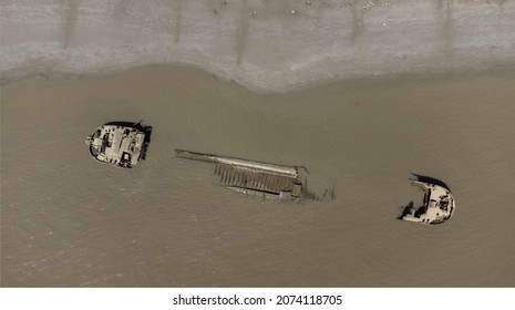 Ship Wreck In The River Scheldt Seen From Above With Drone. Aerial Top Down View