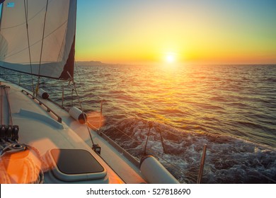 Ship yachts in the open Sea during amazing sunset. Sailing. Luxury boats.  