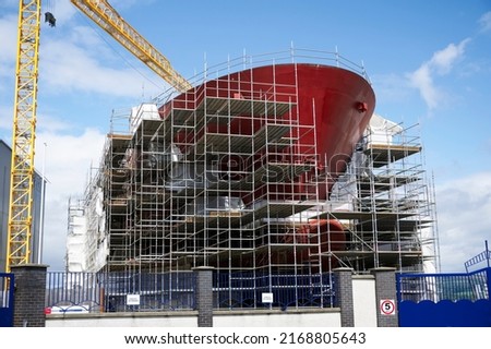 Shipbuilding and crane during ferry construction surrounded by scaffold