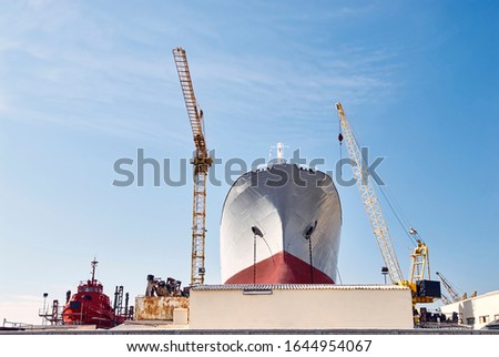 Shipbuilding industry: ship construction in a shipyard. Machinery: naval cranes. Naval production.
