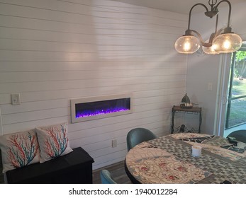 Shiplap Planking On A Wall With Electric Fireplace 