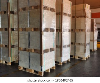 Shipment cartons box on pallets and wooden case on hand lift in interior warehouse cargo for export and sorting goods in freight logistics and transportation industrial, delivery service - Shutterstock ID 1936492465