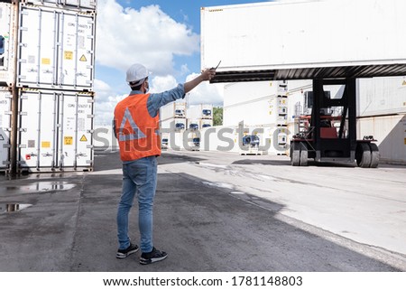 Shipping business background, worker is command to crane set to loading many cargo container ship and airway bill around the world, business to make export and import, logistics transportation concept