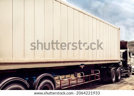 Shipping Cargo Container for Logistics and Transportation on a Truck. Business Logistics Concept,  for Logistic Import Export Background.