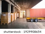 Shipping Cargo Container.Trailer Truck Parked Loading Package Boxes at Dock Warehouse. Cargo Shipment. Supply Chain. Industry Freight Truck Transportation. Shipping Warehousing Logistics.