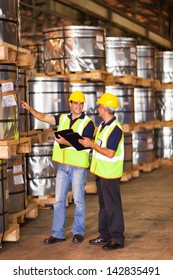 Shipping Company Workers Counting Roll Steel Pallets In Warehouse