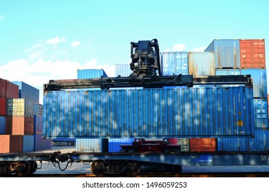 Shipping Container Loading By Richtracker On The Freight Rail Car At Logistic Warehouse Port. Ocean Freight Cargo Shipping, Intermodal Container Freight Concept - Image