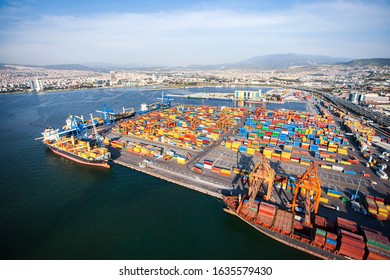 Shipping containers from above. Containers in the port and city view on the background. Drone view of the port of Izmir. - Shutterstock ID 1635579430