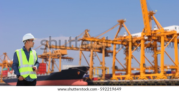 Shipping containers on\
cargo ship engineer.