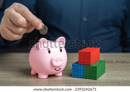 Shipping containers and a piggy bank. Save on delivery and transportation of goods. Logistics and world trade. Discounts and costs
