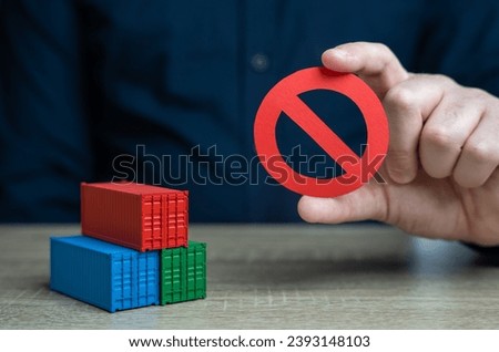Shipping containers and prohibition symbol NO. Ban on import of goods. Sanctions and embargoes. Trade wars. Container shortage crisis. Blocking of cargo and blockade of trade routes.