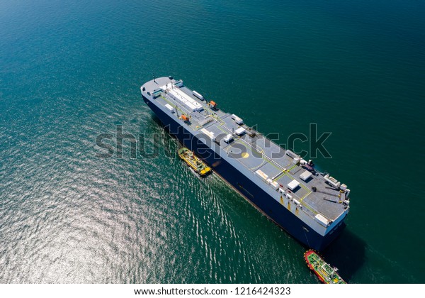 shipping\
loading cars containers business transactions open sea Asian\
pacific import and export logistics oceans service by shipping\
business industry aerial view from drone\
camera