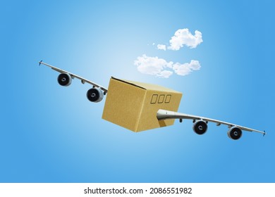 Shipping or travel concept - cardboard box with jet airplane wings and engines in the sky