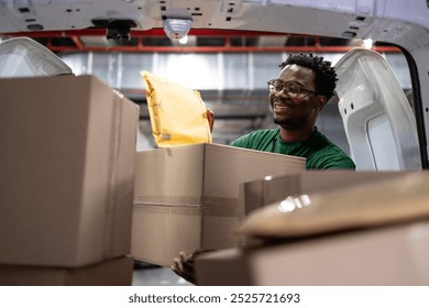 Shipping worker arranging packages and mail inside postal sorting facility. - Powered by Shutterstock