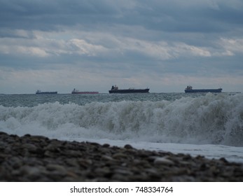 The Ships Are At Anchor In A Stormy Day. View Of The Surf From The Low Point