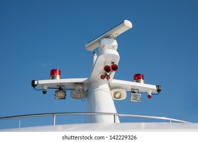 Ships Antenna And Navigation System In A Clear Blue Sky.