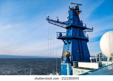 Ships Antenna And Navigation System In A Clear Blue Sky.