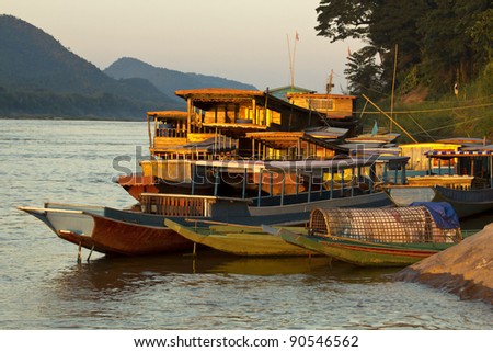 Ships and boats anchored on the river bank of the mekong river